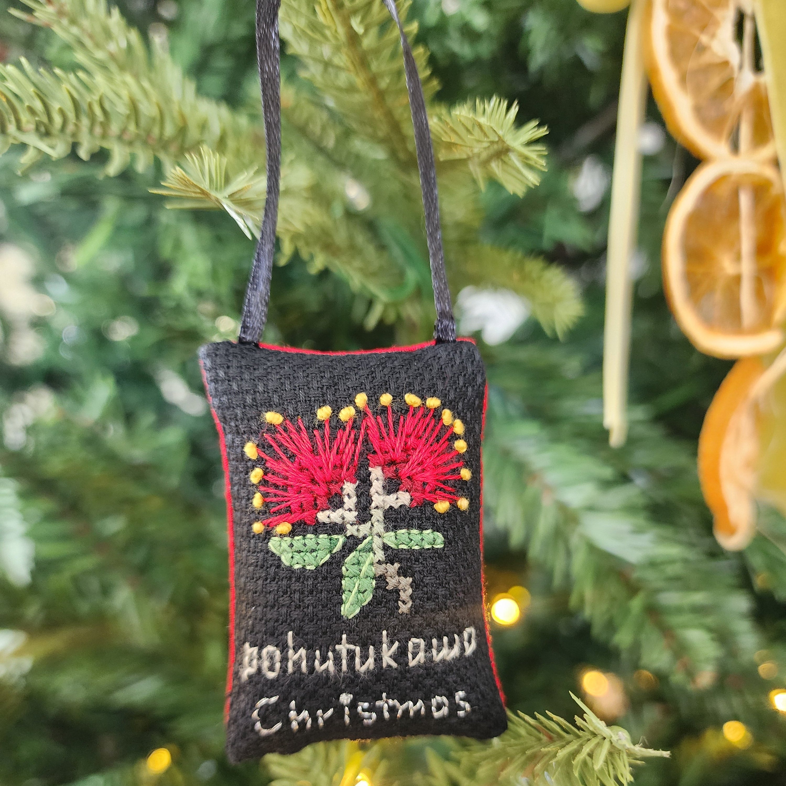 Cross stitch Christmas ornament Pohutukawa Christmas on a black background